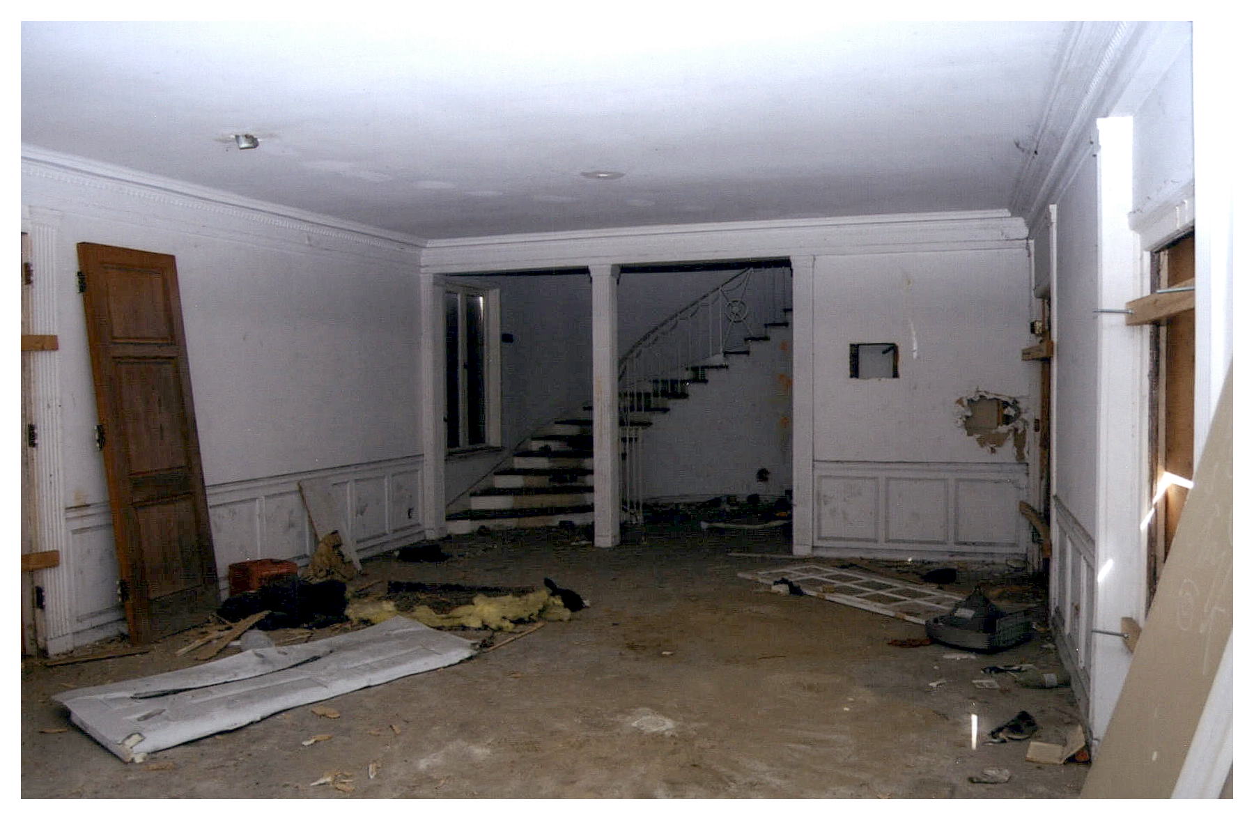 Before: same view of lobby cluttered with debris.