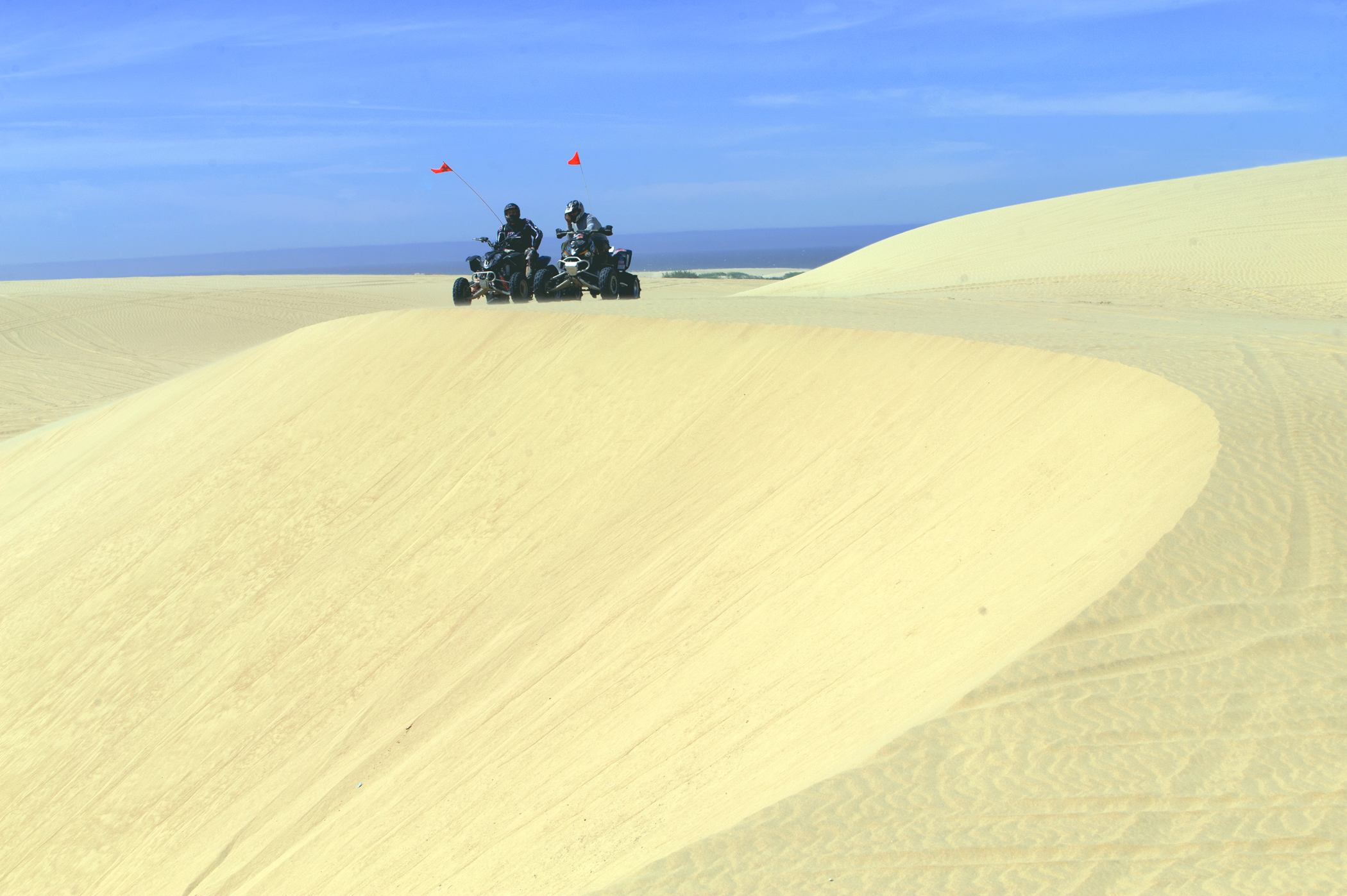 Two ATVs on a Sand Dune