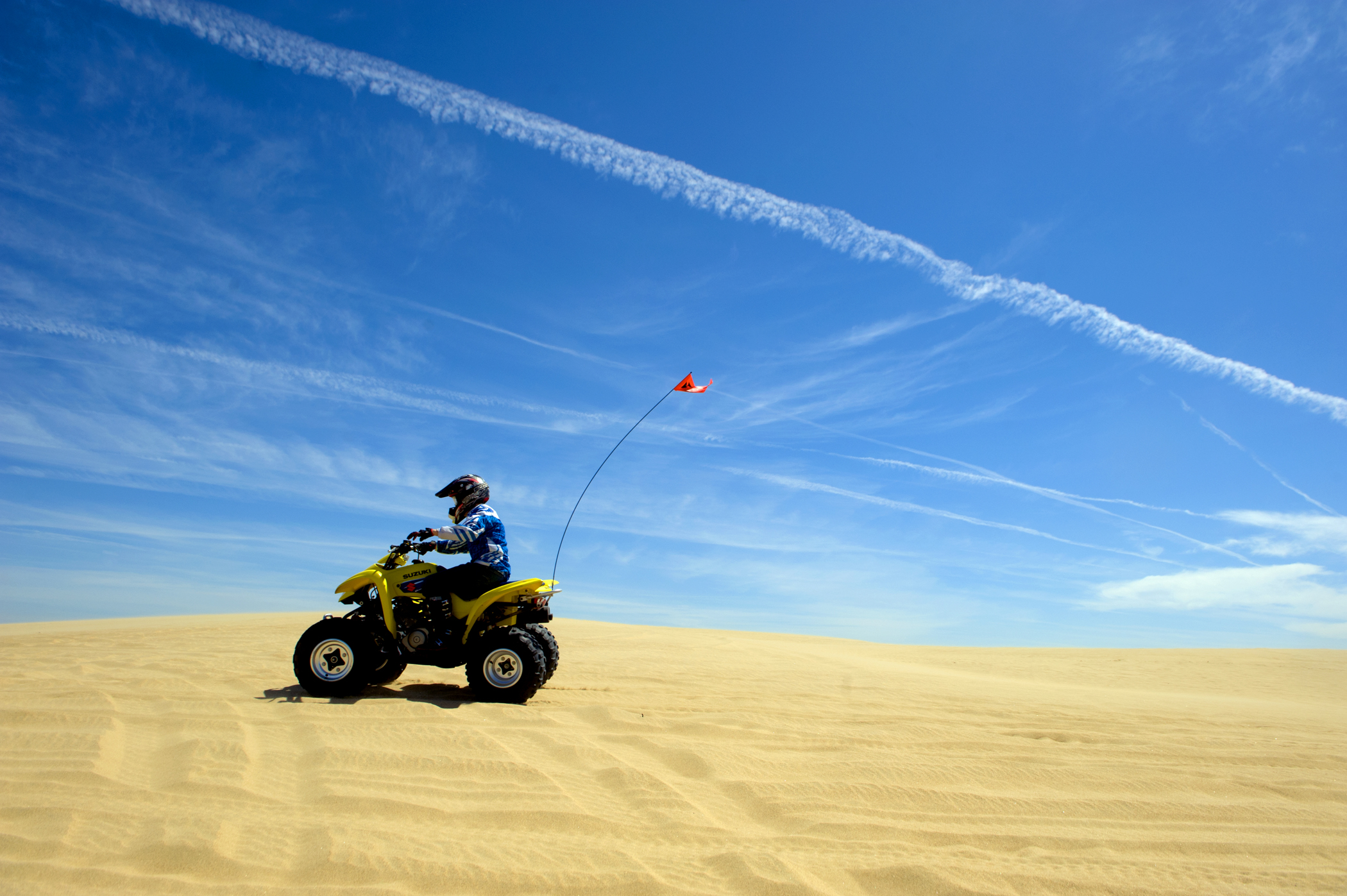 ATV riding on a dune