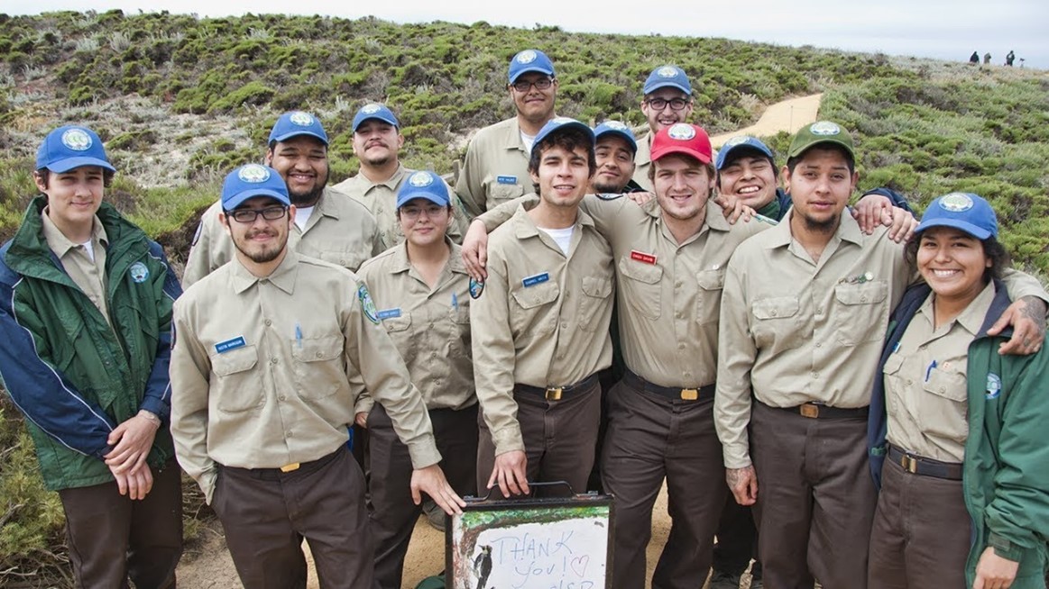 Youth corps members at a work location. 