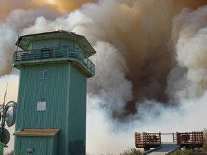 Poomacha fire smoke behind Boucher Hill lookout tower and view platform
