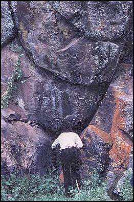 Pictograph at CA-LAK-30 showing location of paintings (center left in photo) above natural crevice in rock exposure. Larry Felton in photo. (Photo: unknown) 