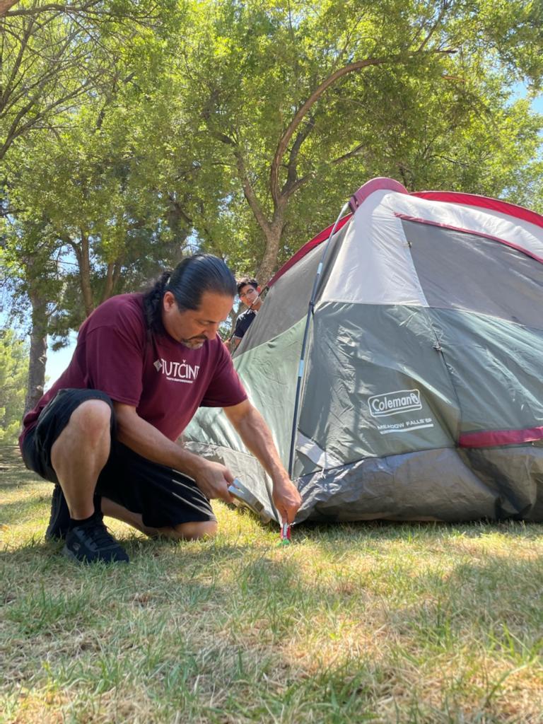 Man Hammering tent