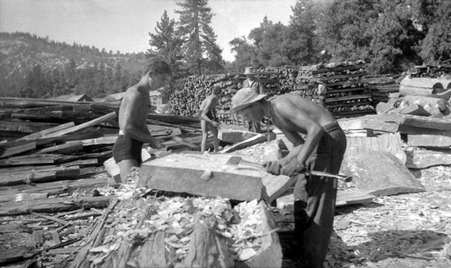 CCC crew hewing picnic table tops in 1934