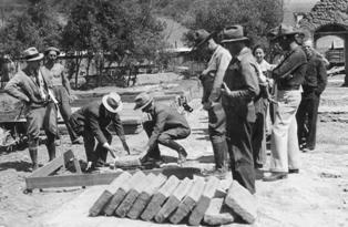 CCC administration laying of the first brick to start reconstruction in 1936