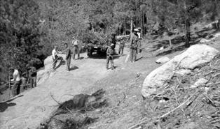 CCC clearing the roadside on truck trail in 1934