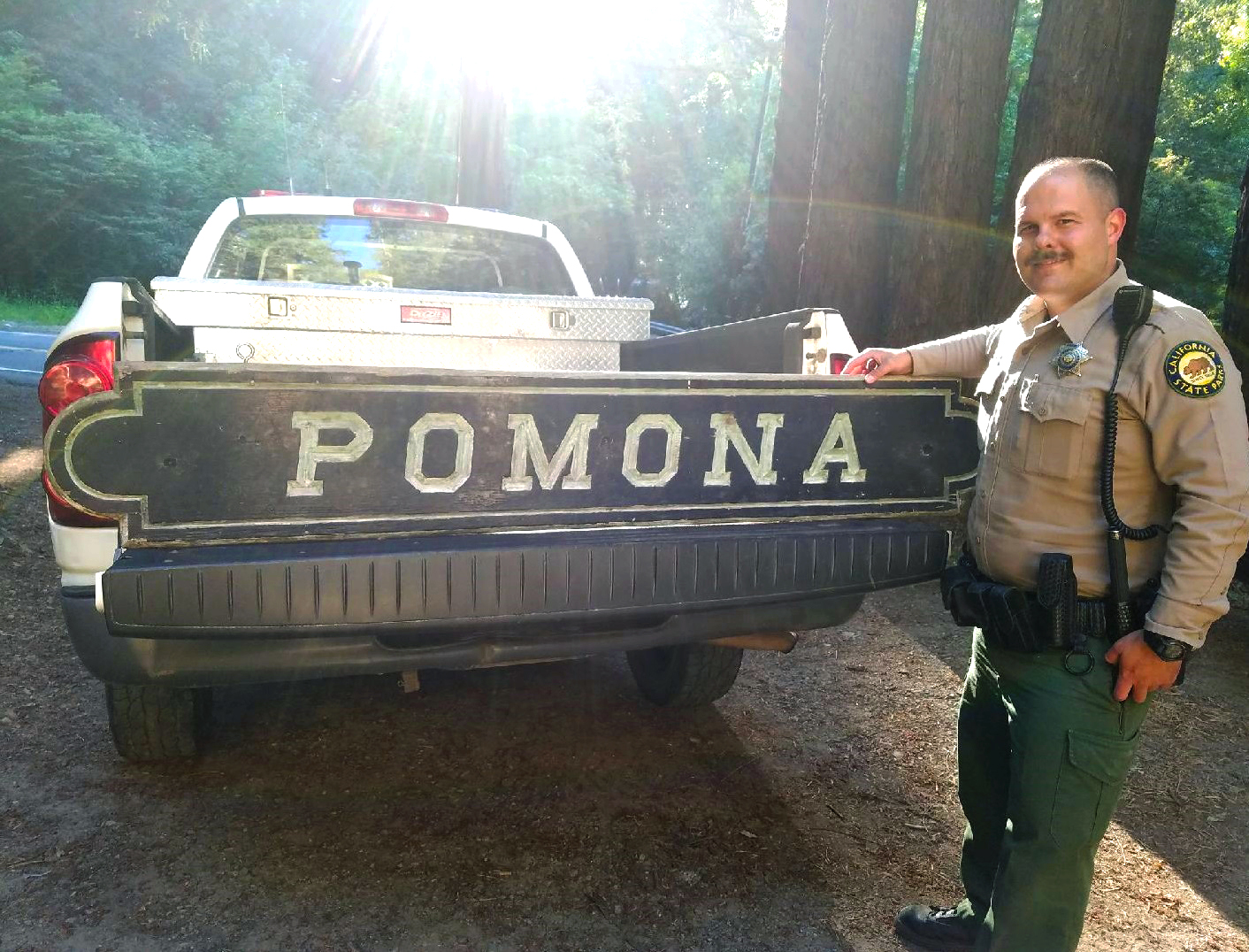 Ranger Mason Harris with recovered Pomona sign