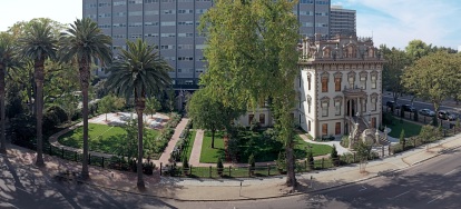 The Leland Stanford Mansion grounds are seen with the Resources Building behind.