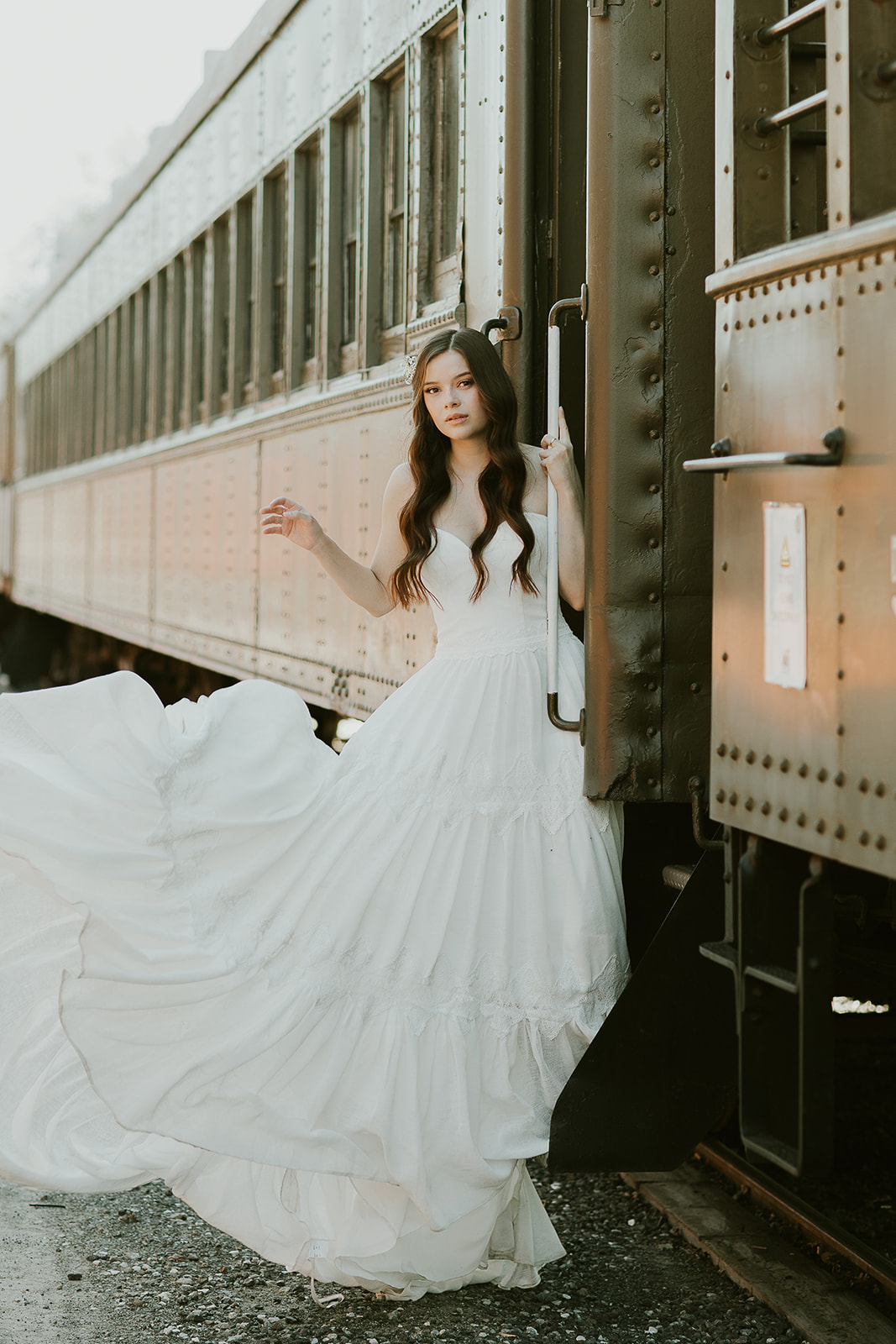 Wedding photo outside historic railcar