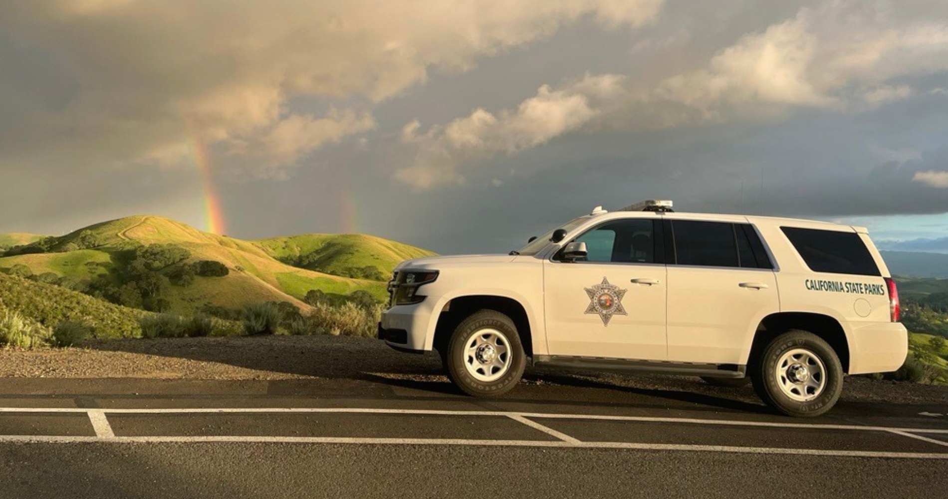 A rainbow over a ranger truck at Mount Diablo