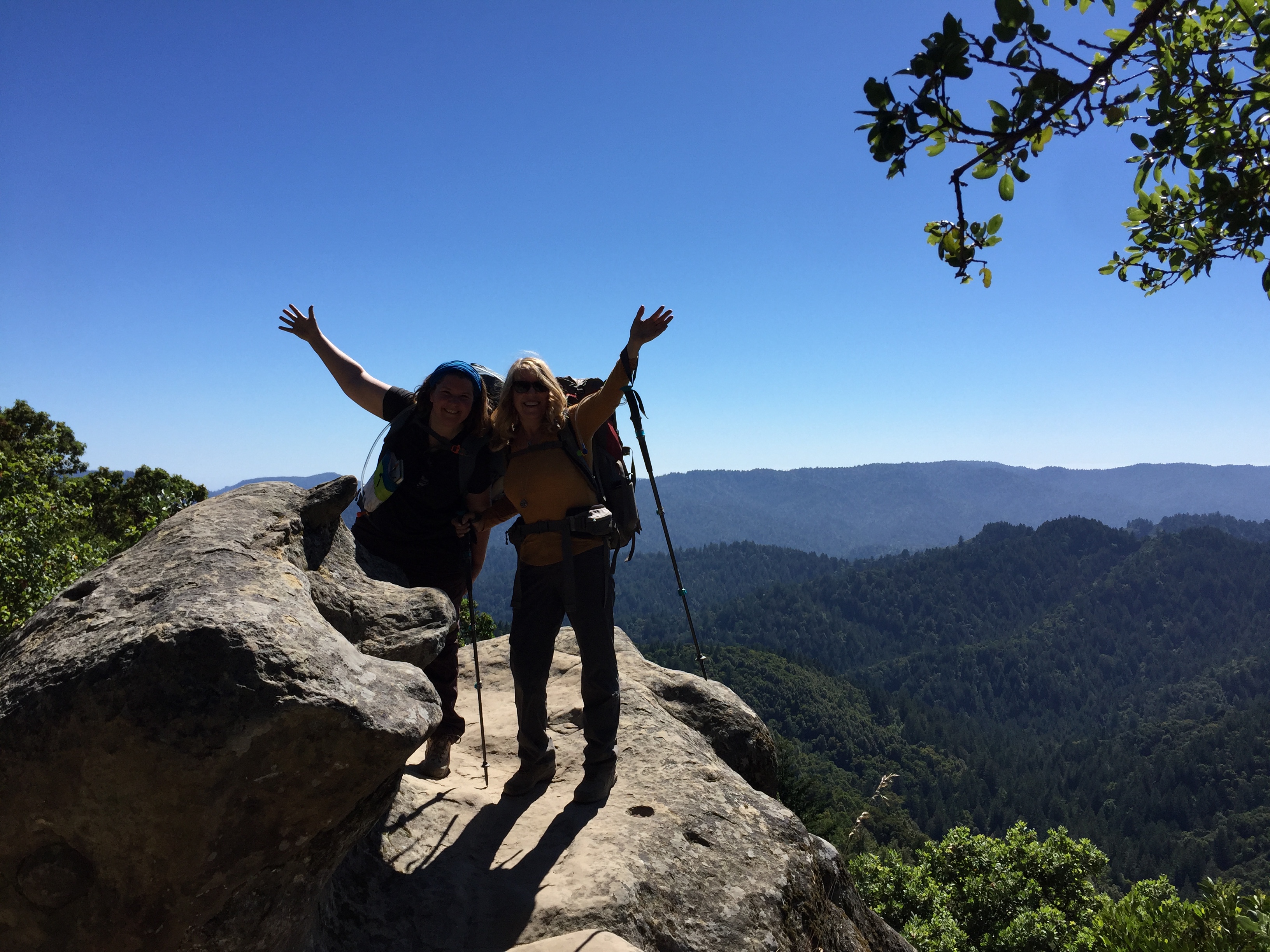 Two women hiking at Castle Rock SP as part of the California State Parks Backpacking Adventures program
