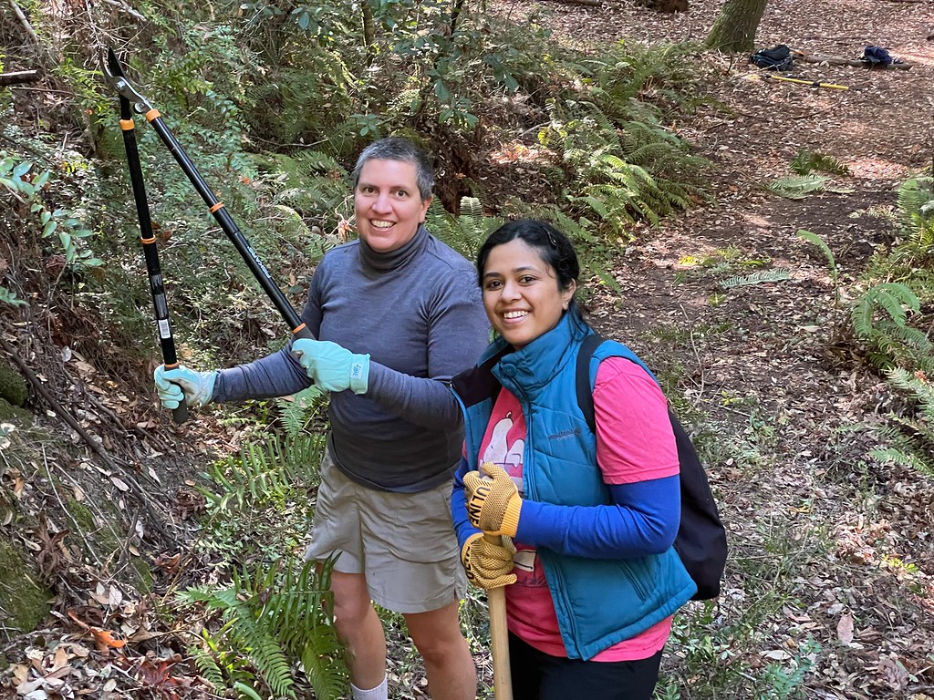 Two female volunteers doing trail work at Portola Redwoods SP