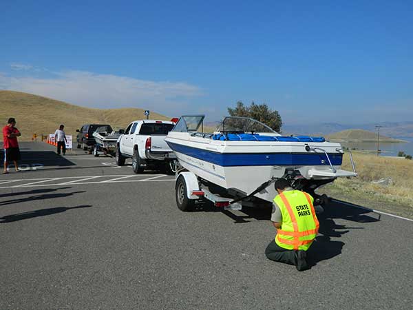 staff check boats coming to use lakes at San Luis Reservoir SRA