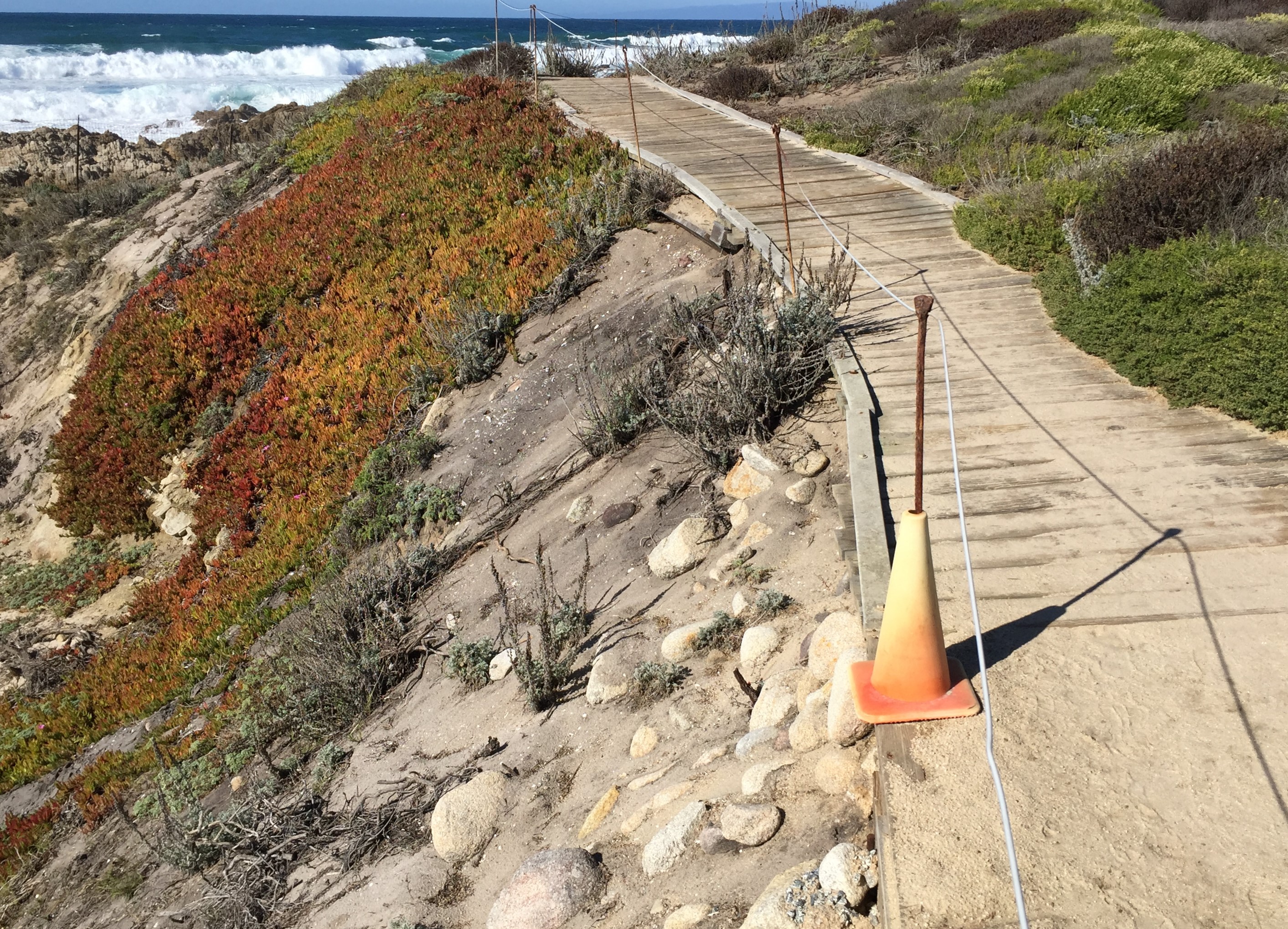 Current boardwalk section with erosion