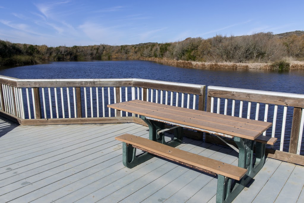 Table in picnic area along boardwalk above the Oso Flaco Lake