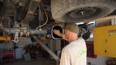 Parks worker inspecting differential