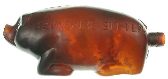 Bottle with BERKSHIRE BITTERS//AMANN & CO/CINCINNATI O embossed on the side.